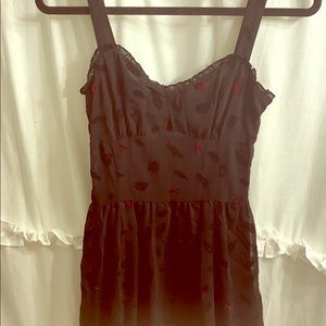 Dang Goodman TRIPP black dress w/ red accents.